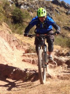 bike tour cusco, biker on rocky mtb trail