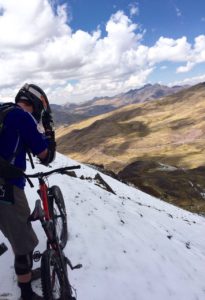 Gravity Peru Bike Team Member on snowy mountain bike trail in Cusco Peru