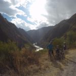 family package peru bike tour, on cliff side with river view