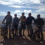 Happy bikers in Peru mountains on biking tour package