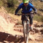 bike tour cusco, biker on rocky mtb trail