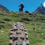 green grass and tire tread shot for peru biking tour