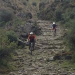 Inca Adventure with two bikers riding mountain bikes in cusco peru