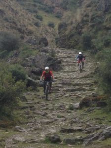 Inca Adventure with two bikers riding mountain bikes in cusco peru